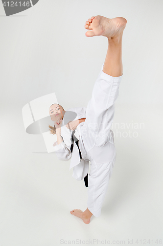 Image of The karate girl with black belt