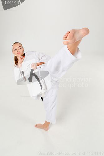 Image of The karate girl with black belt