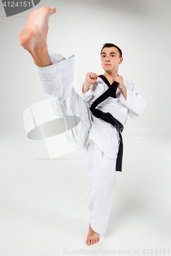 Image of The karate man with black belt