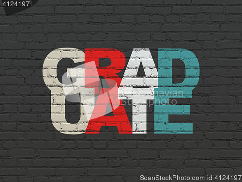 Image of Learning concept: Graduate on wall background