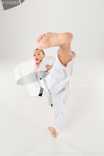 Image of The karate girl with black belt