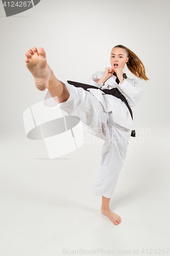 Image of The karate girl with black belt