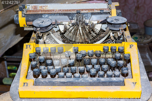 Image of Retro broken typewriter in abandoned place