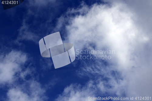 Image of Blue sky with sunlight clouds in evening