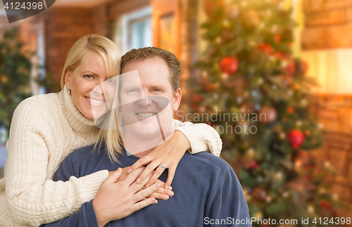 Image of Loving Caucasian Couple Portrait In Front of Christmas Tree