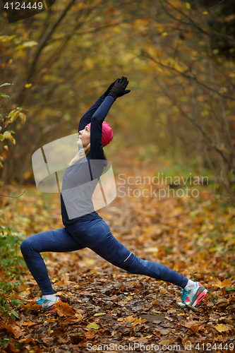 Image of Young blonde on stretching exercises