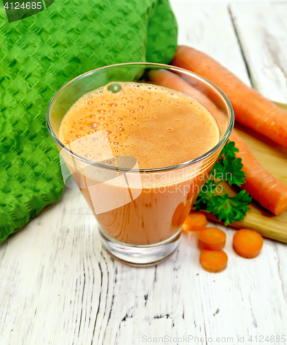 Image of Juice carrot with vegetables and napkin on board