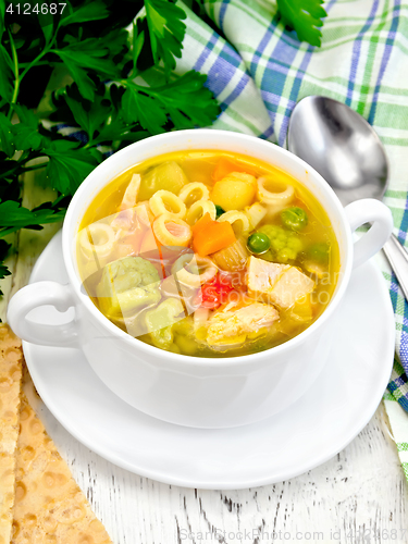 Image of Soup Minestrone in white bowl on board