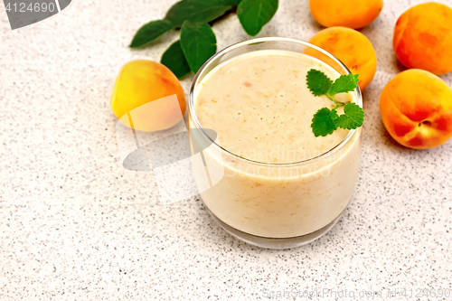 Image of Milkshake apricot with mint on granite table