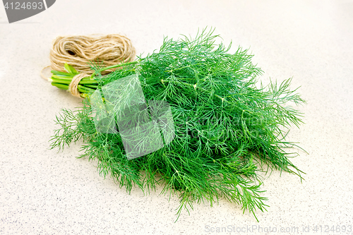 Image of Dill with twine on granite table