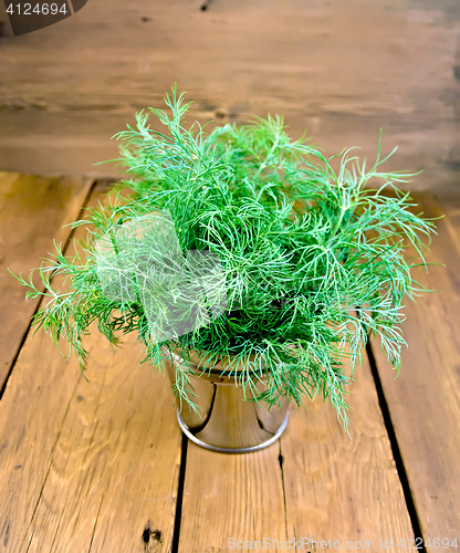 Image of Dill in metal bucket on board