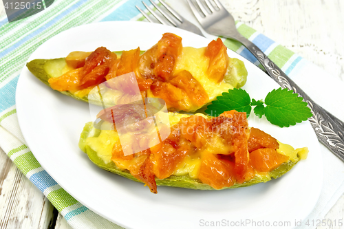 Image of Courgettes in spicy sauce with dried apricots on napkin