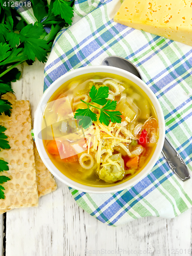 Image of Soup Minestrone in bowl on board top