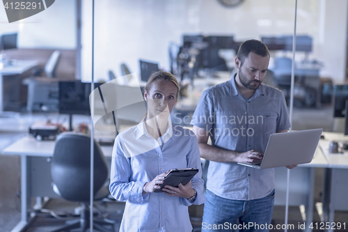 Image of business couple at office