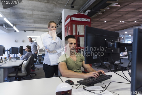 Image of business couple at office
