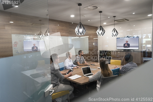 Image of start up business people group attending videoconference call