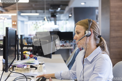 Image of female support phone operator