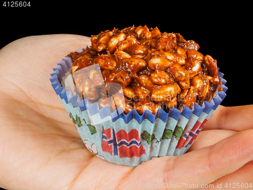 Image of Puffed rice chocolate cake in paper cup with Norwegian flag, in 