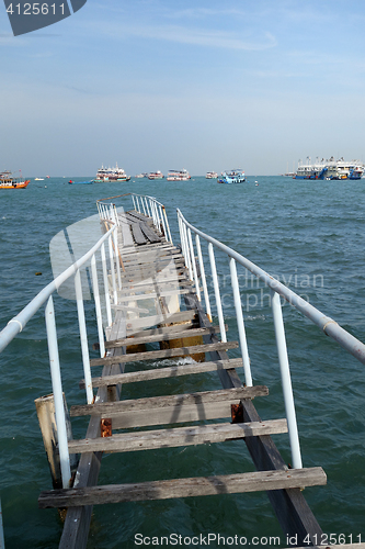 Image of The wooden bridge extending into the sea