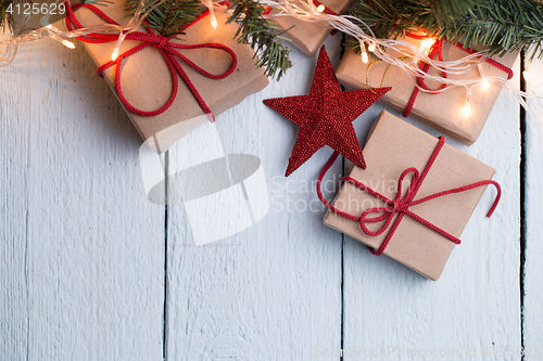 Image of Presents, red stars, pine branch