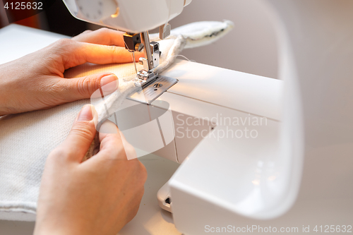 Image of Girl working on sewing machine