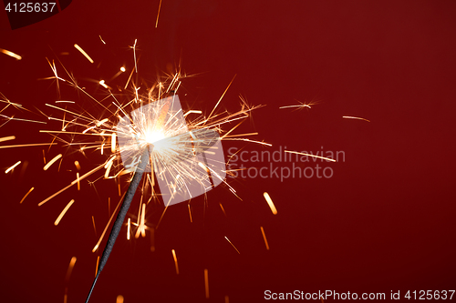 Image of Bengal light on red background