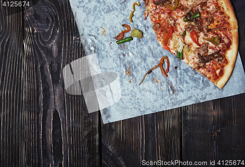 Image of Homemade pizza on a wooden table