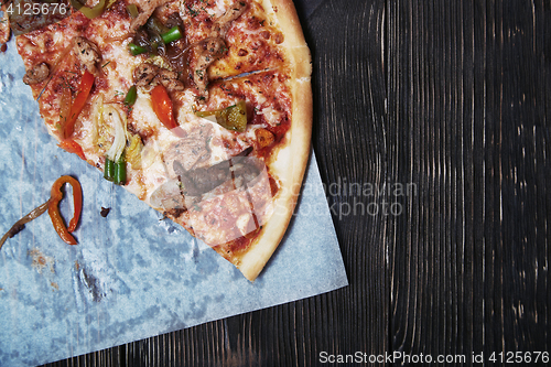 Image of Homemade pizza on a wooden table