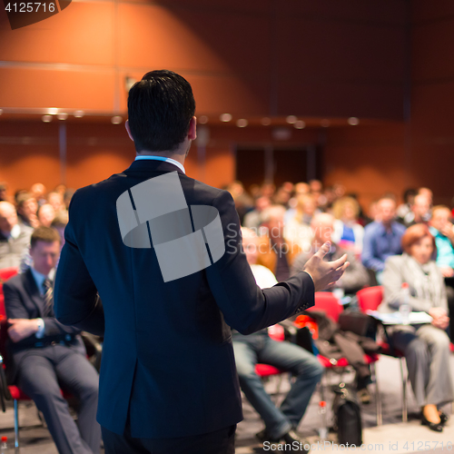 Image of Speaker at Business Conference and Presentation.