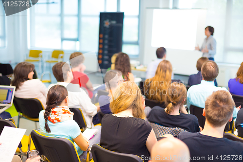 Image of Speaker at Business convention and Presentation.