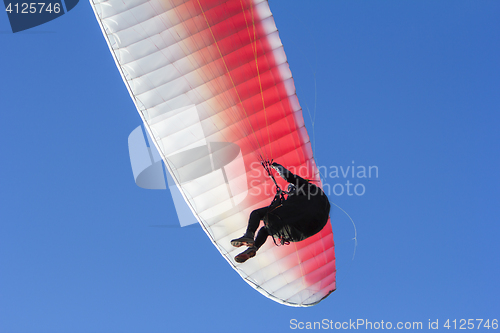 Image of Paragliding on background of blue sky close-up