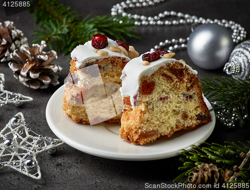 Image of two pieces of christmas cake with fruits and nuts