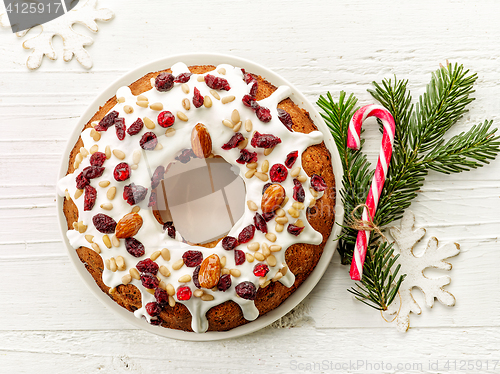 Image of christmas cake on white wooden table