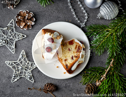Image of two pieces of christmas cake with fruits and nuts