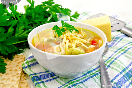 Image of Soup Minestrone in white bowl on napkin