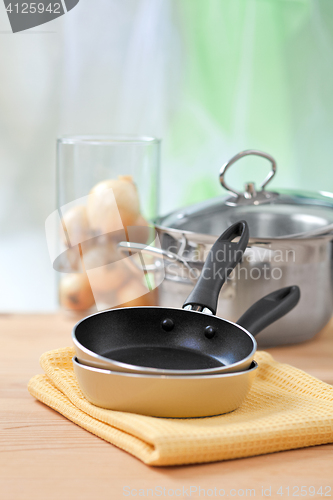 Image of cooking equipment on wooden table