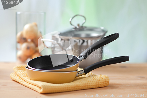 Image of cooking equipment on wooden table