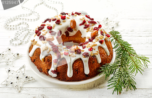 Image of Christmas cake on white wooden table