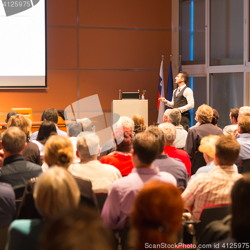 Image of Speaker at Business Conference and Presentation.