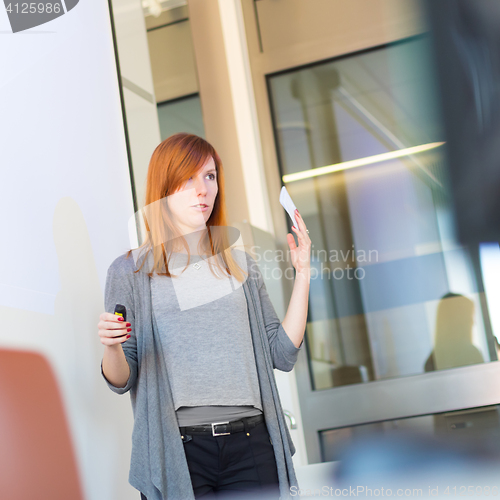 Image of Businesswoman giving a talk.