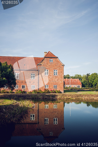Image of Castle made of red bricks with reflection