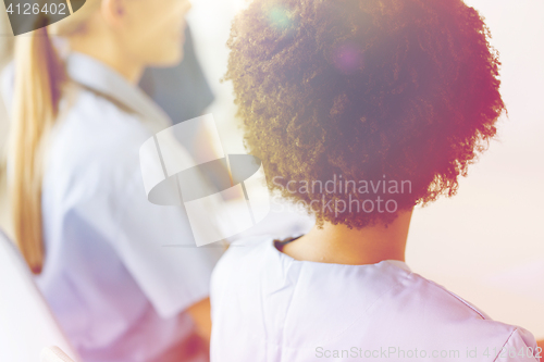 Image of close up of african doctor at hospital from back