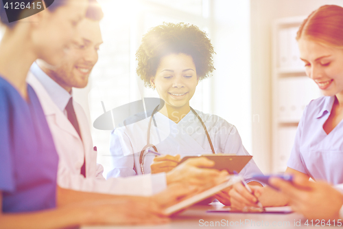 Image of group of happy doctors meeting at hospital office