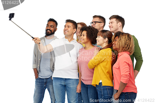 Image of group of people taking selfie by smartphone