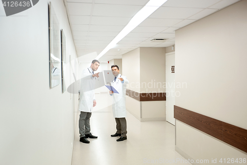 Image of male doctors with clipboard at hospital