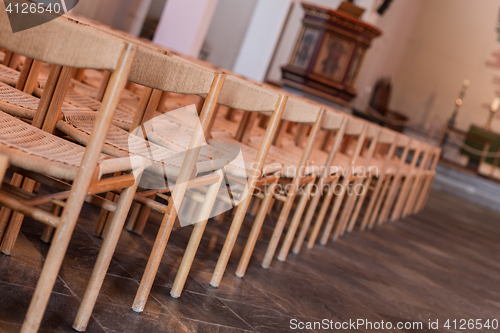 Image of Rows of seats inside church, selective focus