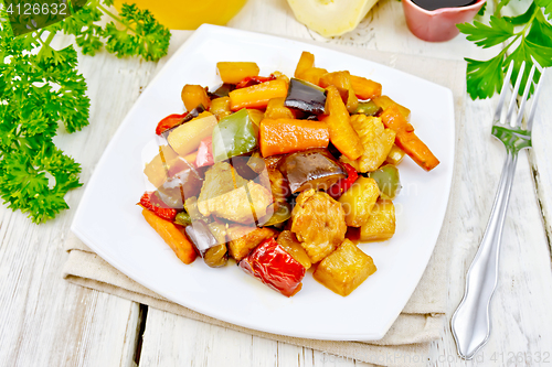 Image of Roast with vegetables and honey in plate on napkin
