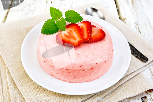 Image of Panna cotta strawberry with mint on light board