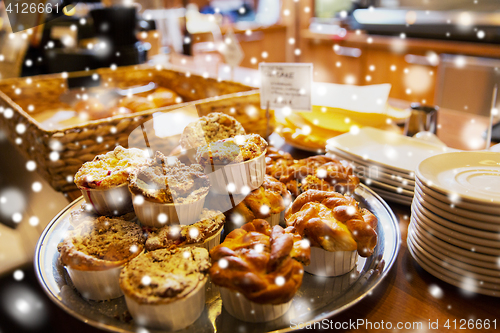 Image of buns and cakes at cafe or bakery