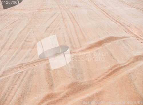 Image of wheel track on sand